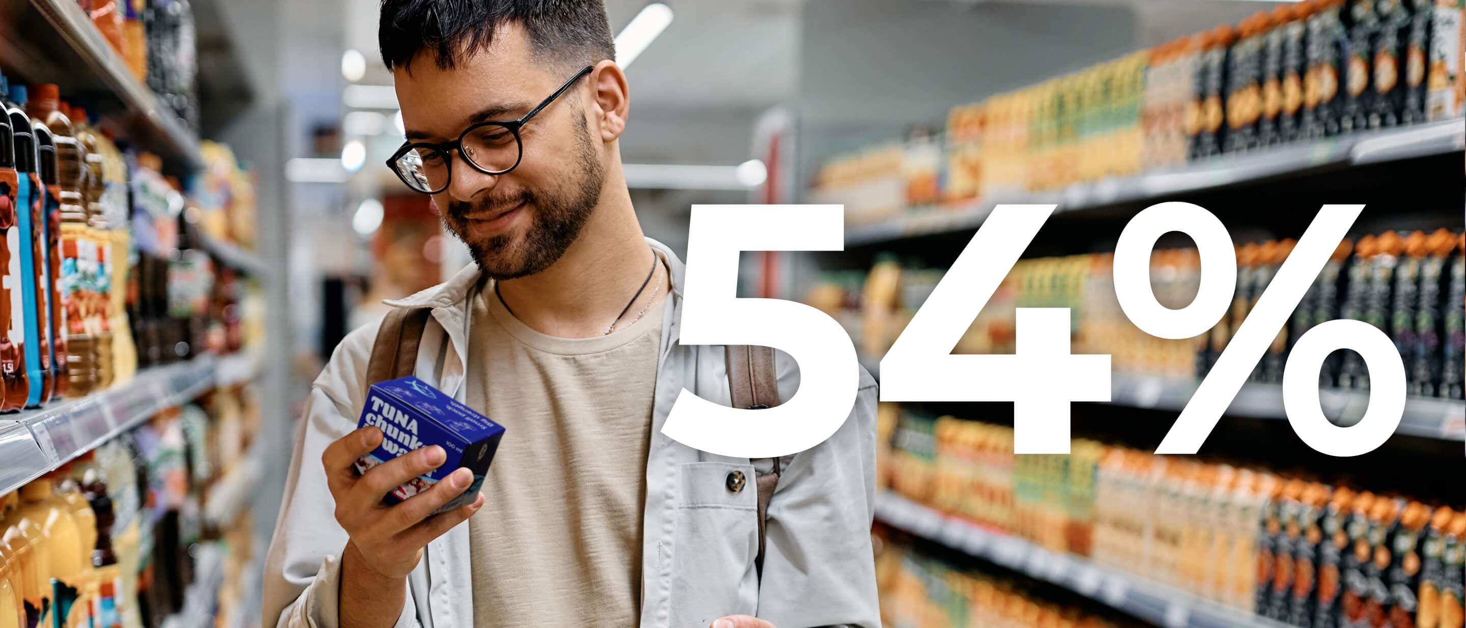 Man in grocery store with tuna in Tetra Recart carton