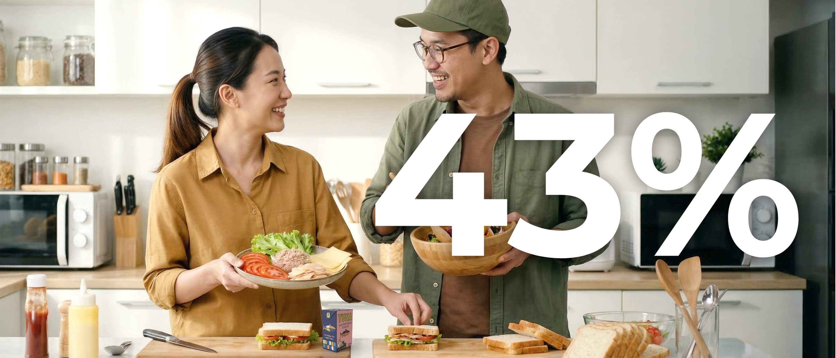 Couple in kitchne making tuna salad, tuna in Tetra Recart carton